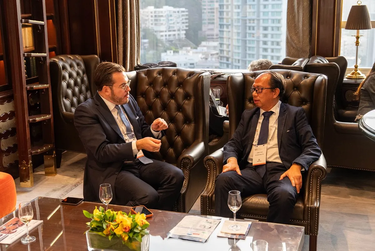 Mining industry professionals discussing opportunities during a private meeting