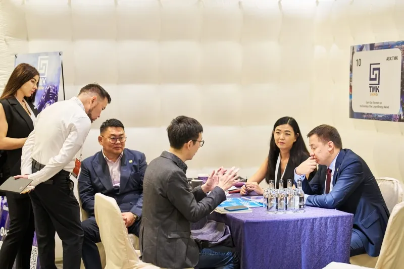 Mining company representatives discussing opportunities during a 1-2-1 meeting